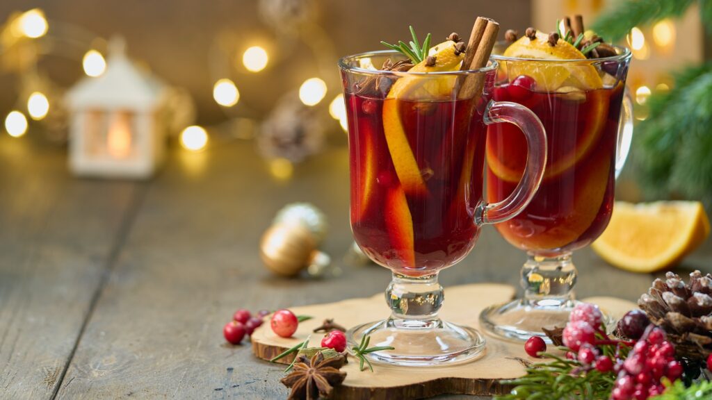 Two glasses of gluhwein. Christmas decoration. Selective focus, blurred background, copy space